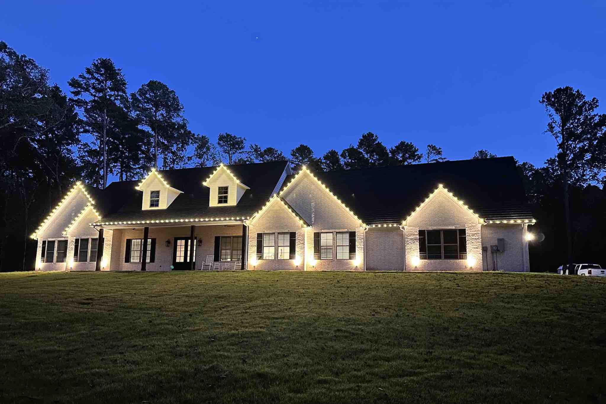 Traditional brick home with Christmas lights in Plano